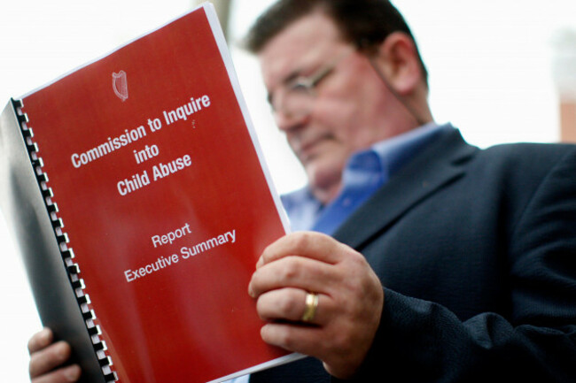 john-kelly-an-abuse-victim-reads-a-copy-of-the-commission-to-inquire-into-child-abuse-in-dublin-ireland-may-wednesday-may-20-2009-a-fiercely-debated-nine-year-investigation-into-irelands